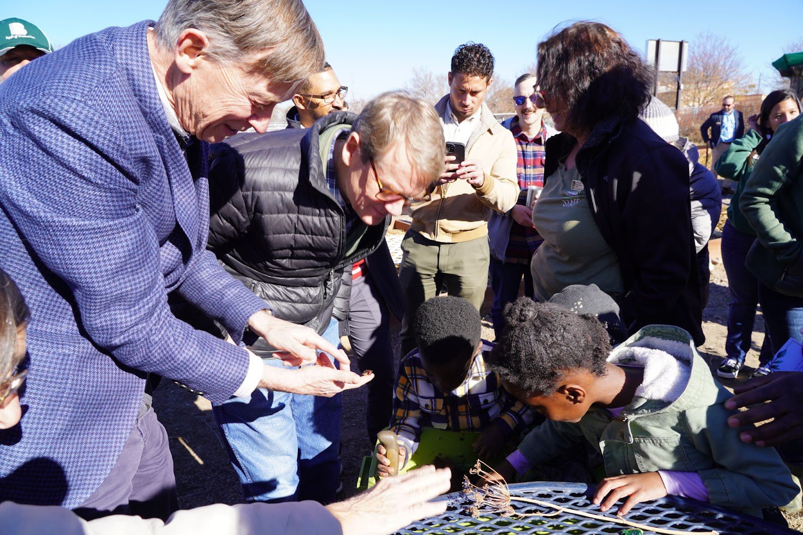 Senators Hickenlooper and Bennet looking at the worm compost bin with DUG's Jungle Judy.